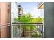 View from balcony shows a shared courtyard garden area at 1401 Delgany St # 211, Denver, CO 80202