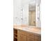 Bathroom vanity with double sinks and a large mirror at 1401 Delgany St # 211, Denver, CO 80202