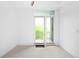Bedroom with neutral carpet and a private balcony at 1401 Delgany St # 211, Denver, CO 80202