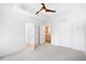 Bright bedroom with light-grey carpet, fan and ensuite bathroom at 1401 Delgany St # 211, Denver, CO 80202