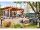 Inviting courtyard with a trellis, ample seating, and a built-in BBQ area at 1401 Delgany St # 211, Denver, CO 80202