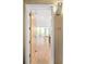 Welcoming entryway leading to a bright living space with hardwood floors and balcony views at 1401 Delgany St # 211, Denver, CO 80202