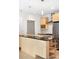 Modern kitchen with stainless steel appliances and island with bar seating at 1401 Delgany St # 211, Denver, CO 80202