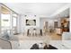 Bright living room featuring a dining area, an open floorplan, and floor-to-ceiling windows at 1401 Delgany St # 211, Denver, CO 80202