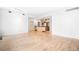 Bright and open living area with hardwood floors and neutral walls and views to the kitchen at 1401 Delgany St # 211, Denver, CO 80202