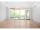 Spacious living room with hardwood floors and large windows providing lots of natural light at 1401 Delgany St # 211, Denver, CO 80202