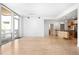 Open-concept living area leads to the kitchen and balcony with lots of natural light at 1401 Delgany St # 211, Denver, CO 80202