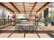 Outdoor patio area with a large dining table, chairs, and a built-in grill at 1401 Delgany St # 211, Denver, CO 80202