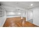 Spacious basement area featuring built-in storage, wood-look floors and white paint at 925 Fulton St, Aurora, CO 80010