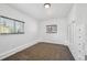 Carpeted bedroom featuring lots of built ins and two windows for natural light at 925 Fulton St, Aurora, CO 80010
