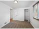 Bedroom featuring a closet, carpet, blinds, natural light, and neutral decor creates a serene atmosphere at 925 Fulton St, Aurora, CO 80010