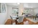 Cozy dining area with a glass table, seating for four, and hardwood floors at 925 Fulton St, Aurora, CO 80010