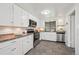 Well-equipped kitchen featuring white cabinets, stainless steel appliances, and granite countertops at 925 Fulton St, Aurora, CO 80010