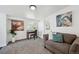 Sitting area with gray couch, desk with a chair and view of outdoor at 925 Fulton St, Aurora, CO 80010
