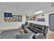 Finished basement with comfortable seating, sports memorabilia and decor for recreational enjoyment at 12079 E Louisiana Ave, Aurora, CO 80012