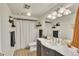 Well-lit bathroom featuring a vanity and shower at 12079 E Louisiana Ave, Aurora, CO 80012