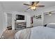 Bedroom boasting a ceiling fan and television at 12079 E Louisiana Ave, Aurora, CO 80012