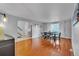 Open-concept dining area with hardwood floors and ample space for entertaining at 12079 E Louisiana Ave, Aurora, CO 80012