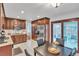 Eat-in kitchen with updated cabinets, appliances, and convenient outdoor access at 12079 E Louisiana Ave, Aurora, CO 80012