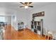 Bedroom with wood floors, a ceiling fan, and space for playing at 12079 E Louisiana Ave, Aurora, CO 80012