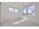 Bright bedroom features natural light from windows and neutral carpet at 657 Harness St, Erie, CO 80516