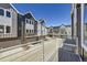 Modern townhome exterior with gray siding, balcony, and attached garage at 657 Harness St, Erie, CO 80516