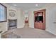 Spacious bedroom with a fireplace and a doorway leading to a full bathroom with dual sinks at 8053 E Maple Ave, Denver, CO 80230