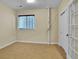 Bedroom with a window and a white door at 8053 E Maple Ave, Denver, CO 80230