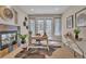Cozy office featuring a fireplace, desk, and natural light at 8053 E Maple Ave, Denver, CO 80230