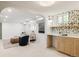 Finished basement with a wet bar, comfortable seating area, and stylish decor at 4261 Julian St, Denver, CO 80211