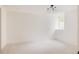 Spacious basement with neutral carpet, white walls and trim, and a well window at 4261 Julian St, Denver, CO 80211