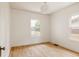 Bright, empty bedroom with hardwood floors and dual windows at 4261 Julian St, Denver, CO 80211