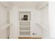 Organized closet with built-in shelving and hanging rods for ample storage space at 4261 Julian St, Denver, CO 80211