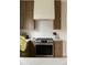 Gourmet kitchen featuring a stainless steel range, wooden cabinets, subway tile backsplash, and modern vent hood at 4261 Julian St, Denver, CO 80211