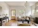 Bright living room with hardwood floors, modern decor, and cozy seating arrangement at 4261 Julian St, Denver, CO 80211