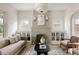 Cozy living room features a decorative fireplace, plush seating, and built-in cabinetry at 4261 Julian St, Denver, CO 80211