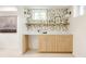 Charming wet bar area featuring patterned wallpaper, a countertop, cabinetry, and natural light from the window at 4261 Julian St, Denver, CO 80211