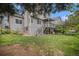 Spacious backyard with mature trees and two-story deck at 9921 Spring Hill Pl, Highlands Ranch, CO 80129