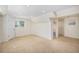 Spacious finished basement features neutral carpet, recessed lighting, and an access door at 9921 Spring Hill Pl, Highlands Ranch, CO 80129