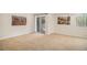 Basement boasts sliding glass door to patio and carpeted flooring at 9921 Spring Hill Pl, Highlands Ranch, CO 80129