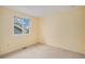 Cozy bedroom with neutral carpet, a window providing natural light, and ample space at 9921 Spring Hill Pl, Highlands Ranch, CO 80129