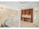 Bright bonus room with built-in wooden desk and shelving, perfect for a home office or study area at 9921 Spring Hill Pl, Highlands Ranch, CO 80129