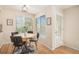 Bright dining area with wood floors, a view to the outside, and a door leading to a patio at 9921 Spring Hill Pl, Highlands Ranch, CO 80129