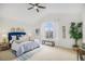 Inviting main bedroom features vaulted ceilings, soft carpet, and a large window with beautiful views at 9921 Spring Hill Pl, Highlands Ranch, CO 80129