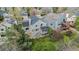 An aerial view of a gray two-story home showcasing backyard deck and mature trees at 9921 Spring Hill Pl, Highlands Ranch, CO 80129