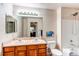 Bathroom featuring double sinks, a toilet, and a shower/tub combination at 4730 Copeland Cir # 204, Highlands Ranch, CO 80126