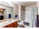 Bathroom featuring single sink and a shower/tub combination with a blue patterned shower curtain at 4730 Copeland Cir # 204, Highlands Ranch, CO 80126