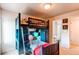 Bedroom with a unique bunk bed with the bathroom visible through an open door at 4730 Copeland Cir # 204, Highlands Ranch, CO 80126