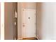Interior entryway with a white door and neutral paint at 4730 Copeland Cir # 204, Highlands Ranch, CO 80126