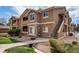 Beautiful condo with manicured landscaping, private entrance and steps leading to second floor at 4730 Copeland Cir # 204, Highlands Ranch, CO 80126